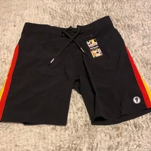 Nice board shorts/swim suit.